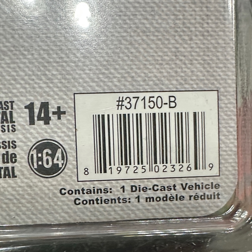 Norman Rockwell Die-Cast Vehicle Packaging with Gray and Black